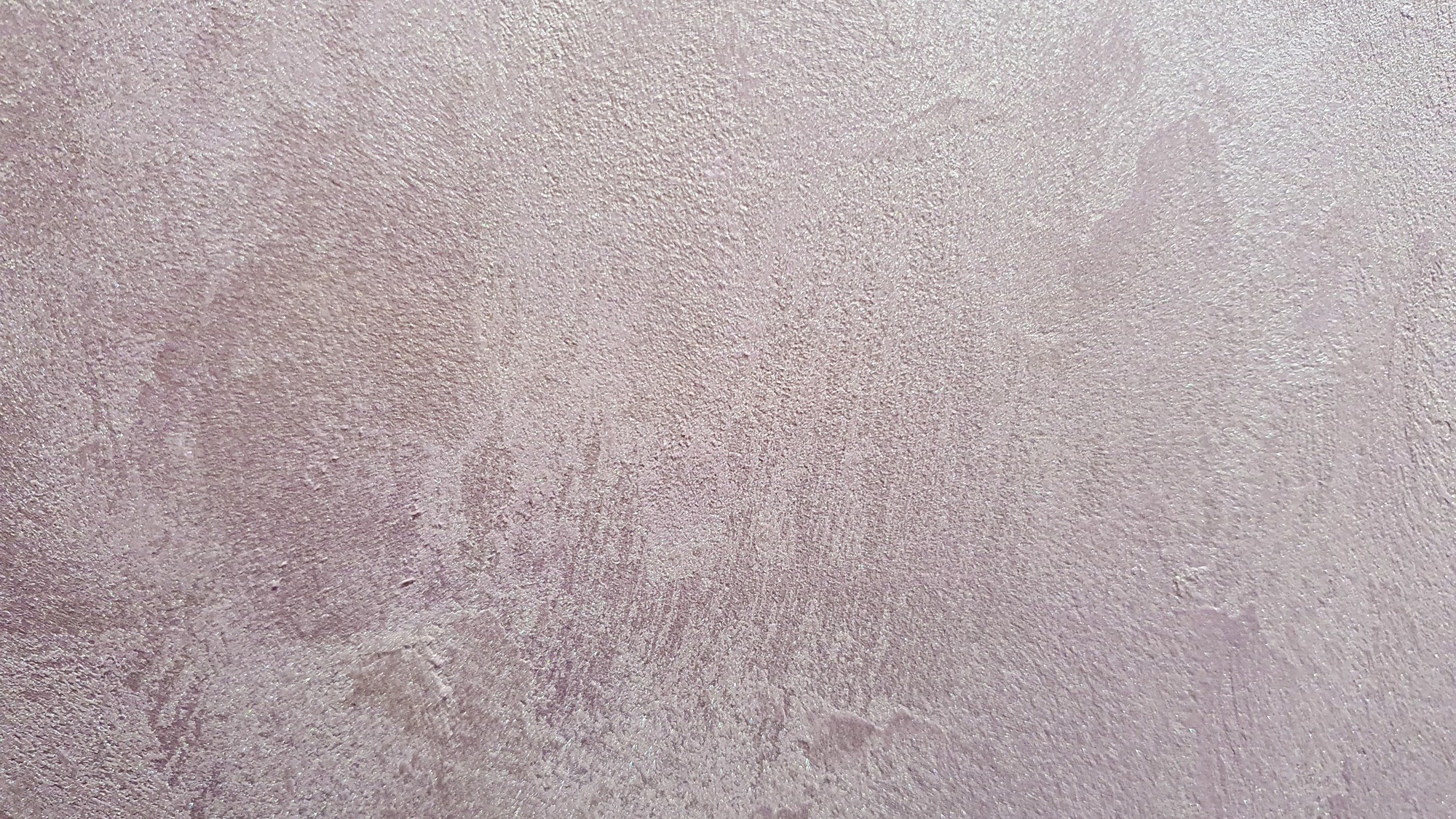 Decorative plaster of lilac color, with a silver coating. natural texture. selective focus.